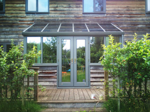 Grey painted lean-to timber conservatory